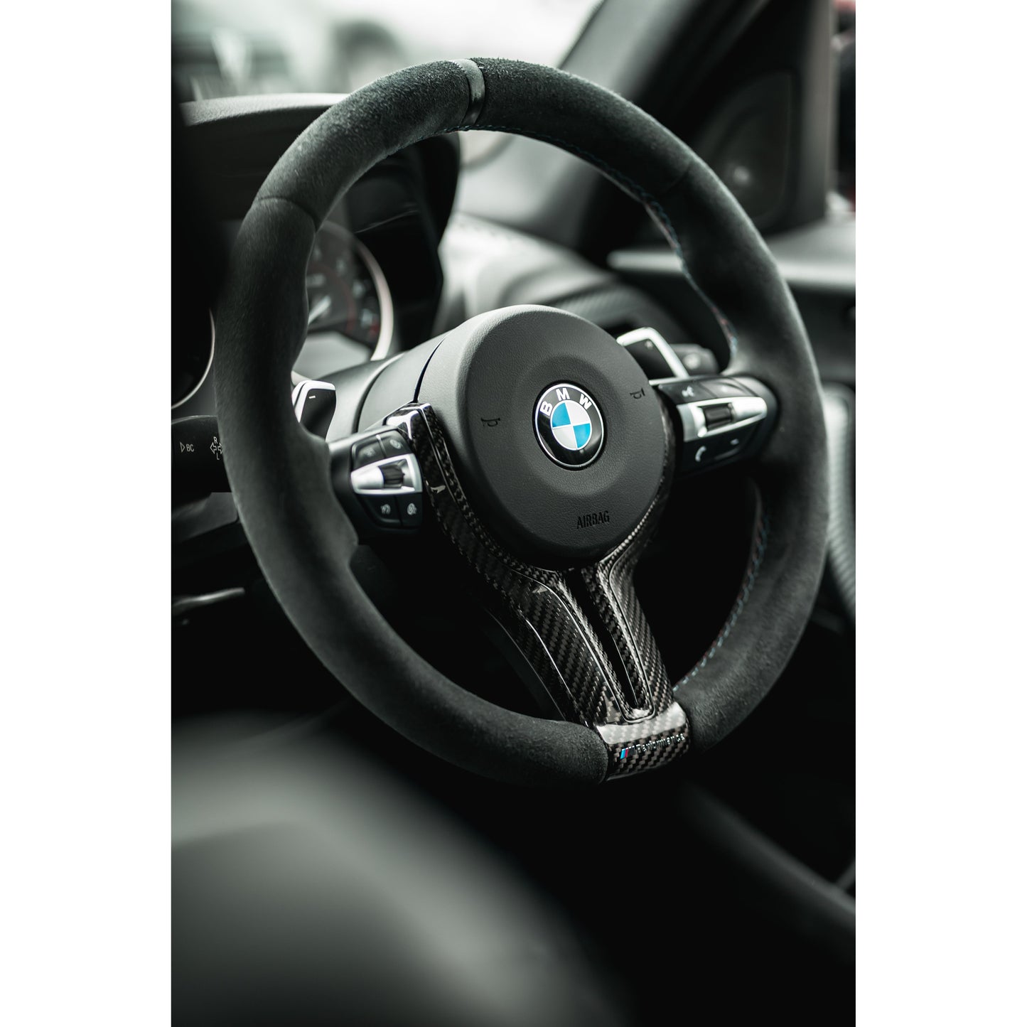 Front view of B58Bible BMW F-Series Steering Wheel M1/M2 + Cruise Control Multifunction Switches in Silver fitted to a steering wheel on the car