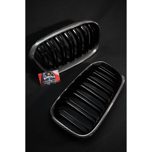 Front view of both Bmw 1 Series F20 Carbon Fibre Kidney Grilles (M135i/M140i)